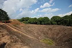 The massive explosion crater at the top of Eliane 2, created by Viet Minh sappers who blew up the fortified outpost during the battle.