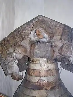 Laminar armor from hardened leather with pauldrons reinforced by wood, worn by Native Siberians