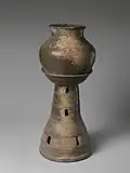 Jar and tall stand with perforated base (in Silla)