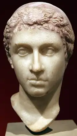 Cleopatra, mid-1st century BC, showing Cleopatra with a "melon" hairstyle and Hellenistic royal diadem worn over the head, now in the Altes Museum[1][3][435]