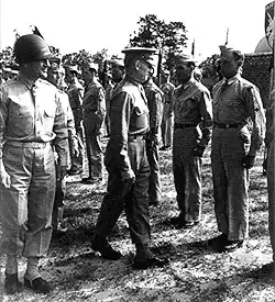 A black and white photograph which shows two army commanders inspecting their soldiers arranged in formation