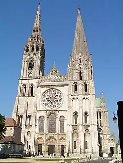 Rose window and facade of Chartres Cathedral (1194–1220) (North spire rebuilt in Flamboyant style from 1507 to 1513
