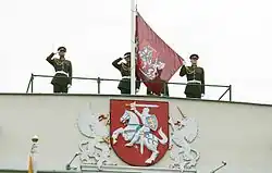 The presidential version of the coat of arms, as depicted on the Presidential Palace, and the flag of the president of Lithuania