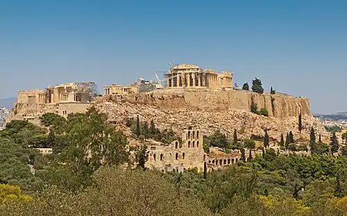 Acropolis of Athens, a noted polis of Classical Greece. The polis was the whole city, which had its own walls. Shown is a part of the polis, the akropolis, "city heights", which was never alone regarded as its own city. The origins of the settlement are lost in prehistoric times. Also included in the classical Athenian polis were suburban locations in the region of Attica, such as the port, Piraeus.