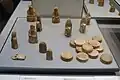 Objects from the Lewis Hoard: ten chessmen, twelve tablemen, and the buckle