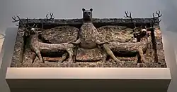 Room 56 – Sculpture of the god Imdugud, lion-headed eagle surmounting a lintel made from sheets of copper, Temple of Ninhursag at Tell al-'Ubaid, Iraq, c. 2500 BC