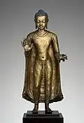 Buddha offering protection; late 6th–early 7th century; copper alloy; height: 47 cm, width: 15.6 cm, diameter: 14.3 cm; from India (probably Bihar / Later Gupta dynasty); Metropolitan Museum of Art