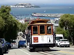 A cable car on a steep urban street