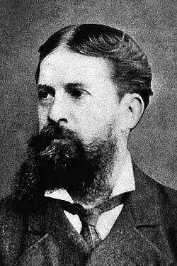 Black-and-white photo of a bearded man