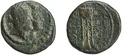 A coin depicting a queen and a king. The queen's portrait is in the front.
