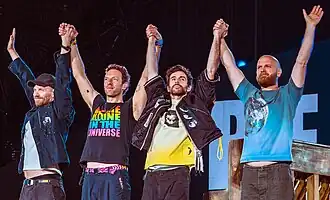 Coldplay preparing to bow on stage after performing