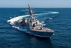Flight III ship USS&nbsp;Jack H. Lucas showing the larger AN/SPY-6 arrays, stacked rigid-hull inflatable boats, and slight exhaust stack modifications