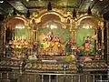 Gaura-Nitai (left), Radha-Vrindaban Chandra (center), and Sri Gopalnathaji (right) idols at New Vrindaban, West Virginia, United States
