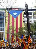 The Demonstration "Catalunya, nou estat d'Europa" of 11 September 2012.[24] Estelada hanging between Carrer de Mallorca and Carrer de València, along Passeig de Gracia.