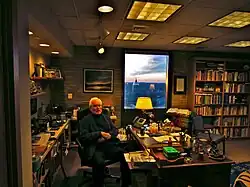 Hesburgh sitting at his desk