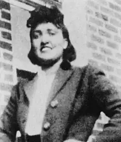 A black-and-white photo of Lacks smiling