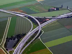 Two level semi-directional T interchange in Orbe, Switzerland. 46°43′42″N 6°34′11″E﻿ / ﻿46.72836°N 6.569738°E﻿ / 46.72836; 6.569738