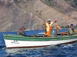 Chilean fishermen with lobsters