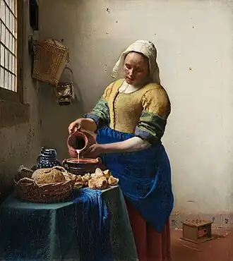 The Milkmaid by Johannes Vermeer (c. 1658). Vermeer was lavish in his choice of expensive pigments, including lead-tin yellow, natural ultramarine, and madder lake, as shown in the vibrant painting.[20]