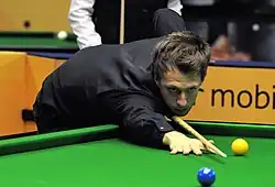 Judd Trump after playing a shot.