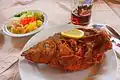Fried carp with beer and salad