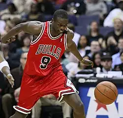 Luol Deng chasing after a loose ball