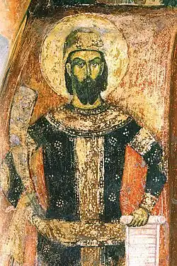 Bearded man with hat and dark clothing