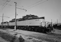 An electric locomotive with its pantographs down