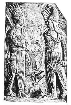 Mithras-Helios (right), with solar rays and in Iranian dress,[28] with Antiochus I of Commagene (Mt. Nemrut, 1st century BCE)