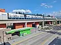 Western side of Mountlake Terrace Station with a train in the foreground.