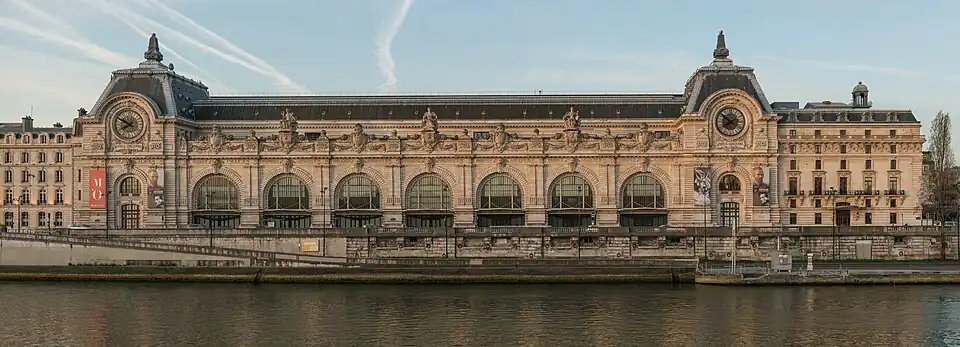 Beaux Arts Doric pilasters on the façade of the Gare d'Orsay, Paris, designed by Victor Laloux in c.1896–1897, and built in 1898–1900[29]