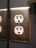 Ordinary duplex socket mounted in ground-pin down orientation.