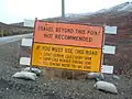 Sign north of Nome, Alaska, providing warning of the road, unpopulated area beyond