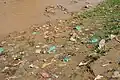 Evidence of open defecation along a riverbank in Bujumbura, Burundi
