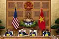 The Vietnamese flag being hoisted alongside the American flag in the Government Office during Biden's 2023 state visit to Vietnam.