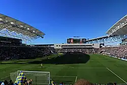 A filled open air soccer stadium