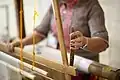 Pineapple-plant fiber and silk threads being woven in a traditional loom