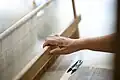 Contemporary Philippines weaver demonstrating pineapple-plant fiber and silk cloths being woven in a traditional loom