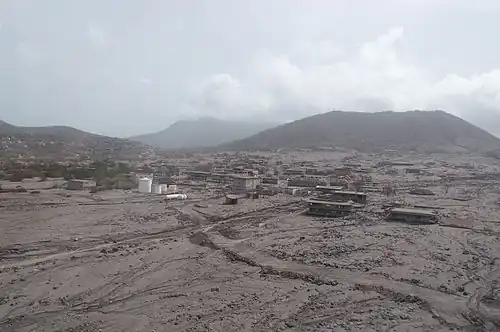 Aerial view of Plymouth, Montserrat, buried under grey volcanic ash