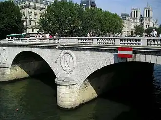 Haussmann reconstructed the Pont Saint-Michel connecting the Île de la Cité to the left bank. It still bears the initial N of Napoleon III.