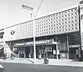 Premier Supermarket on Station Road (1963), now an Iceland supermarket; the site was originally home to the Harrow Coliseum cinema which was demolished in 1956[100]