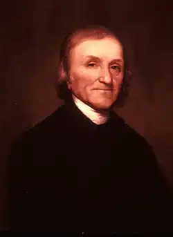 Half-length portrait of an elderly Priestley with wispy brown hair. He is wearing a black jacket and a white shirt.