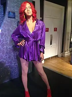 Wax statue of Rihanna with red hair