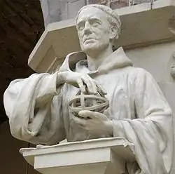 Photo of a sculpture of a man wearing robes