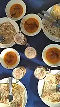 Roti canai served with teh tarik is a typical Malaysian breakfast.
