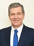 75th governor of North Carolina Roy Cooper (B.A. 1979, J.D. 1982)[294]