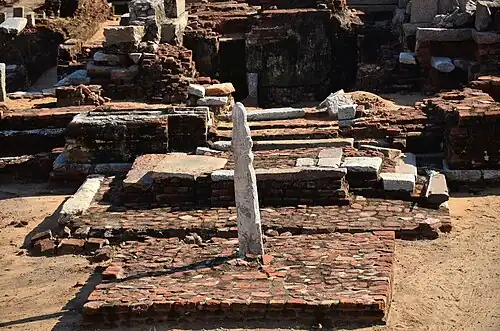 Stone vel on a brick platform at the entrance to the Murugan Temple, Saluvankuppam, unknown architect, 300 BC[99][100]
