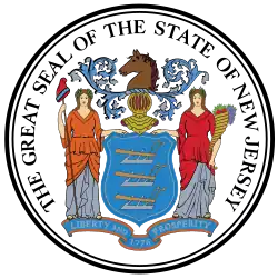 The seal shows a shield with three plows, a gold helmet facing forward, a horse on top looking left, and two female figures, Liberty on the left and Ceres on the right. Liberty is holding a staff with the Phrygian cap on the right hand while Ceres holds a cornucopia overflowing with various fruits with one of the hands of both figures touching the shield. At the bottom, the state's motto, "Liberty and Prosperity" and the year, 1776. Outside of the coat of arms, the words "The Great Seal of the State of New Jersey" is printed circling around a circle border.