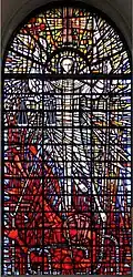 St Michael and the Devil at the church of St Michael Paternoster Row, by English artist John Hayward combines traditional methods with a distinctive use of shard-like sections of glass.