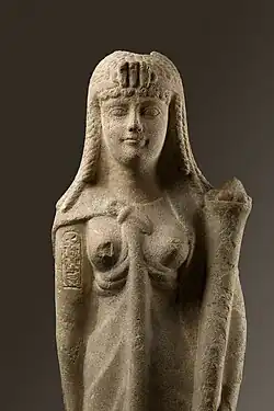 A marble statue of Cleopatra with her cartouche inscribed on the upper right arm and wearing a diadem with a triple uraeus, from the Metropolitan Museum of Art[465]